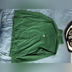 Adidas green fleece half zip sweater. It’s never got to be worn; brand new.
